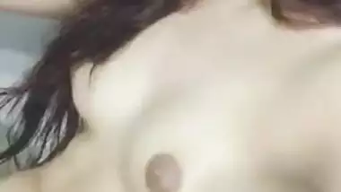 Risque Indian babe takes breasts and pussy out in a short porn video