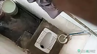 XXX clip of village aunty taking bath in outdoor taken on hidden cam her son
